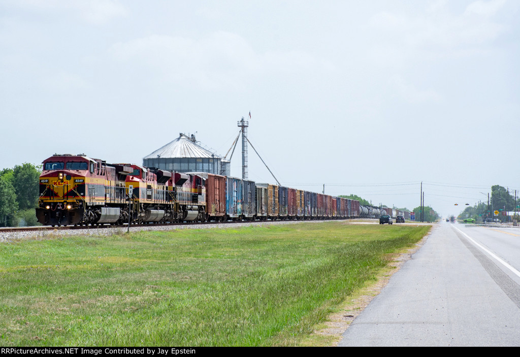A southbound KCS train passes through the small town of Beasley, Texas